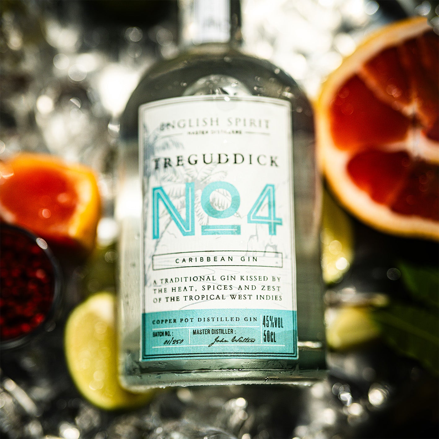Treguddick No.4 Caribbean Gin - 50cl bottle. Featuring a bottle with tropical motifs, set against a backdrop of tropical fruit.
