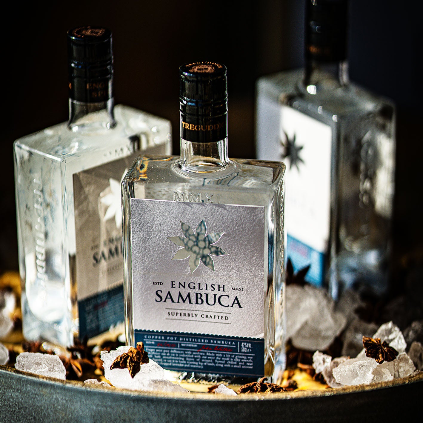 Bottle of English Sambuca with decorative elements on a dark background