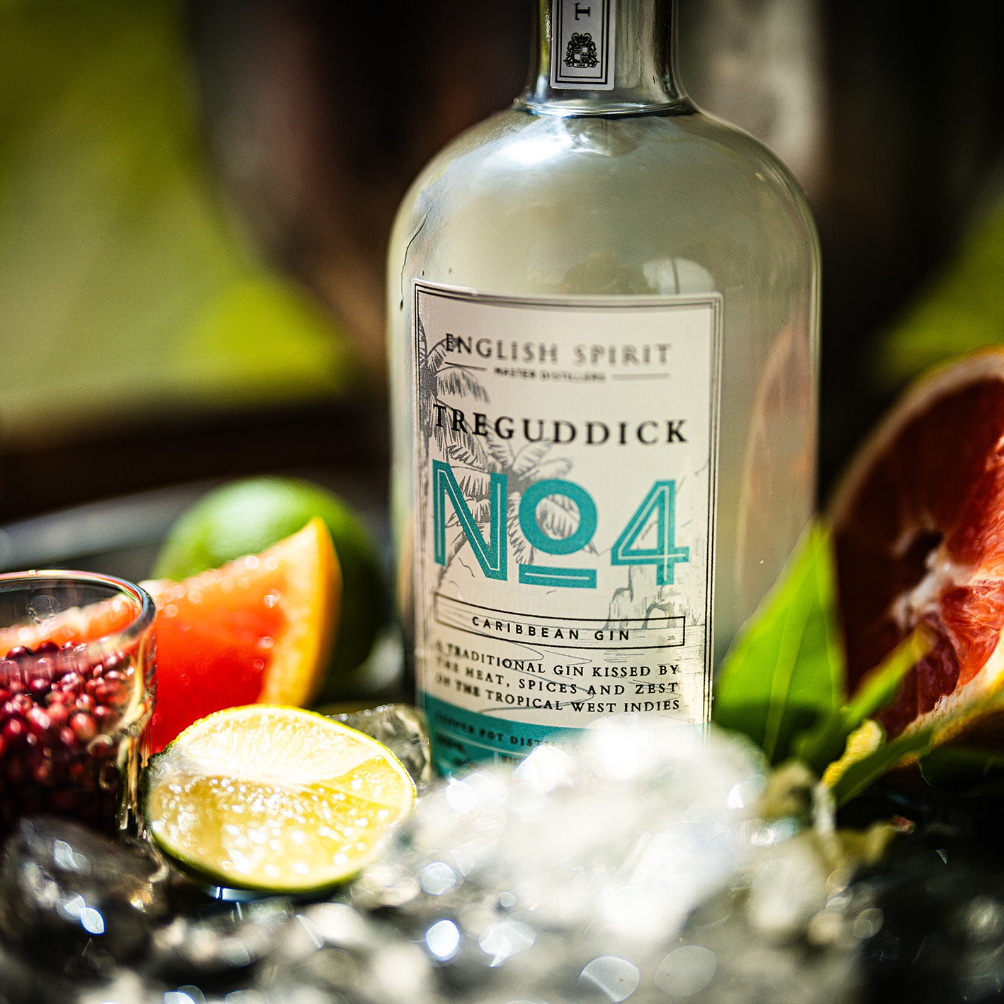 Treguddick No.4 Caribbean Gin - 50cl bottle. Featuring a bottle with tropical motifs, set against a backdrop of tropical fruit.